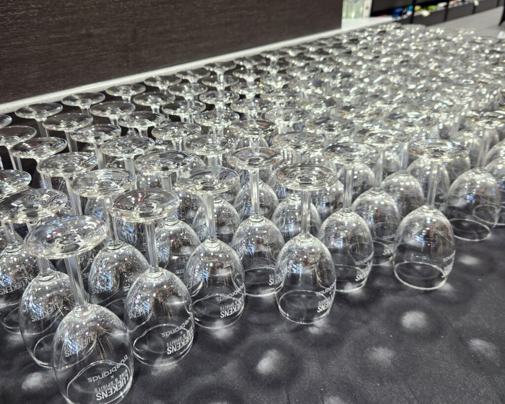 wine glasses lined up for the 2025 Luekens Summer Soirée wine tasting in Tampa midtown